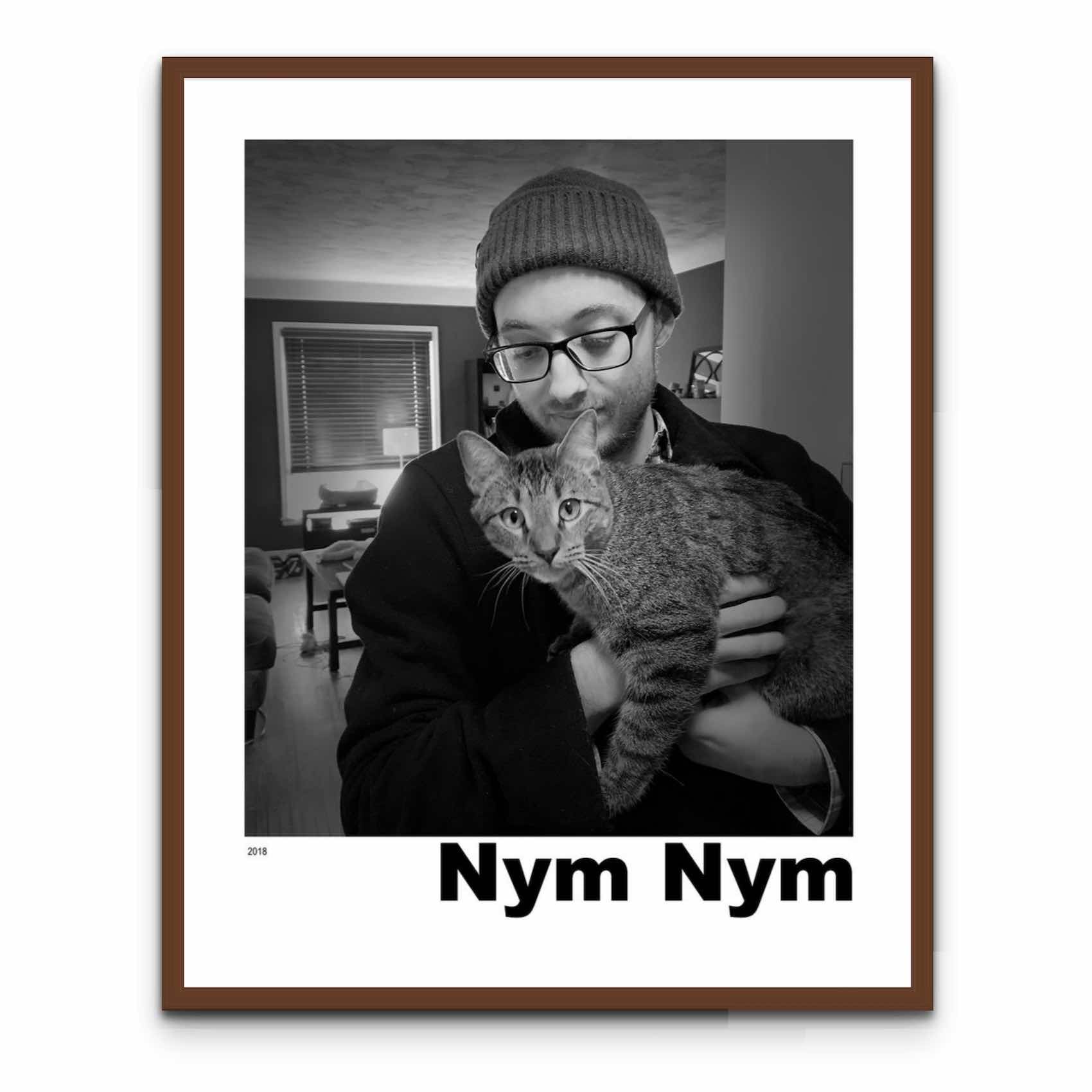 a black and white photo of a man holding a cat